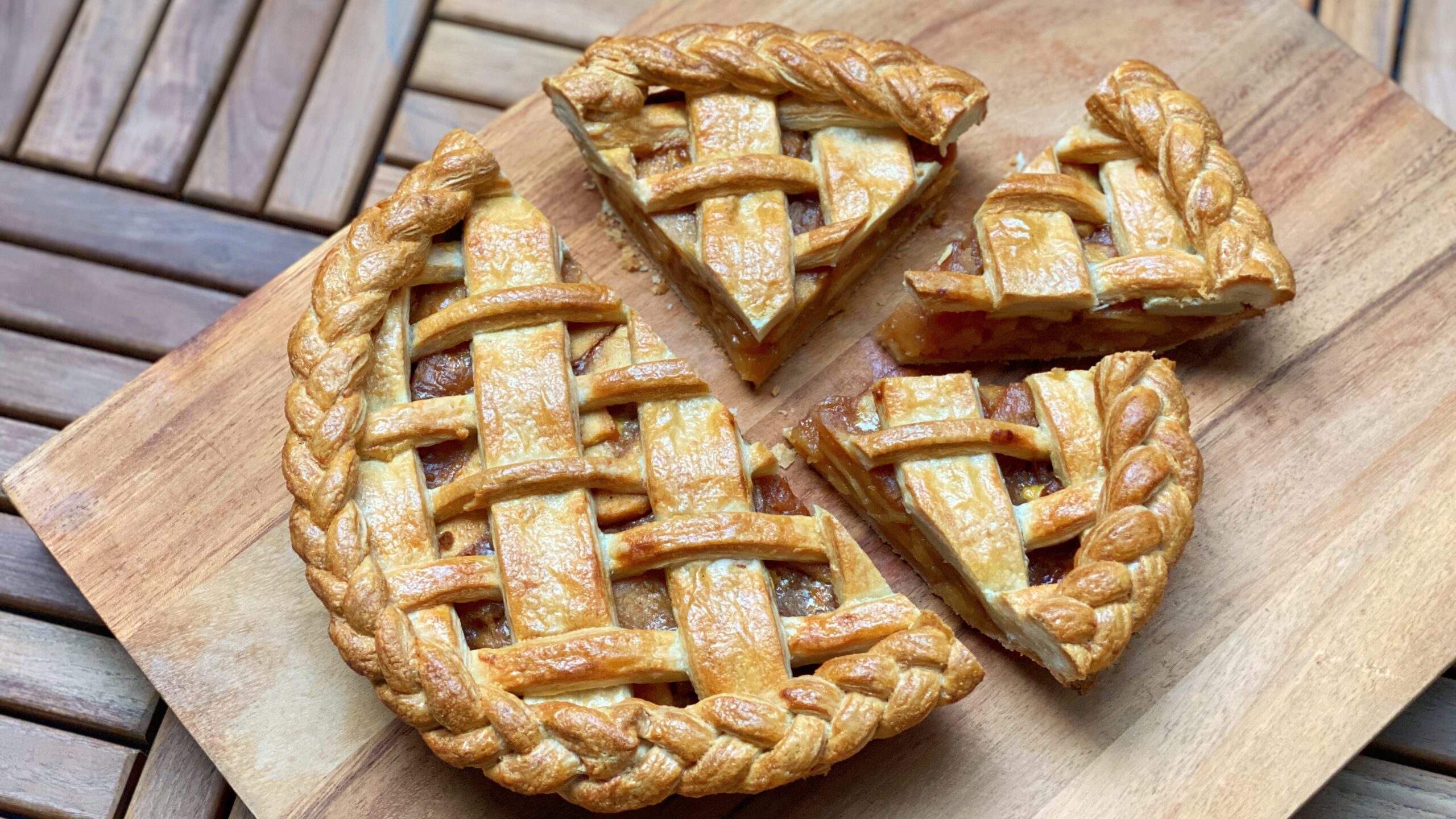 Homemade apple pie with a few pieces cut out